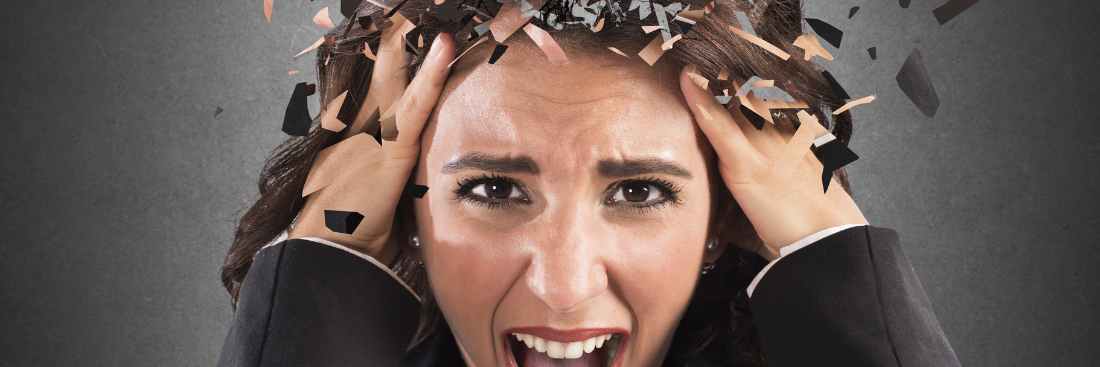 A person looking stressed and their head is exploding