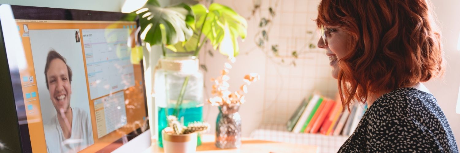 A person on a video call on a laptop